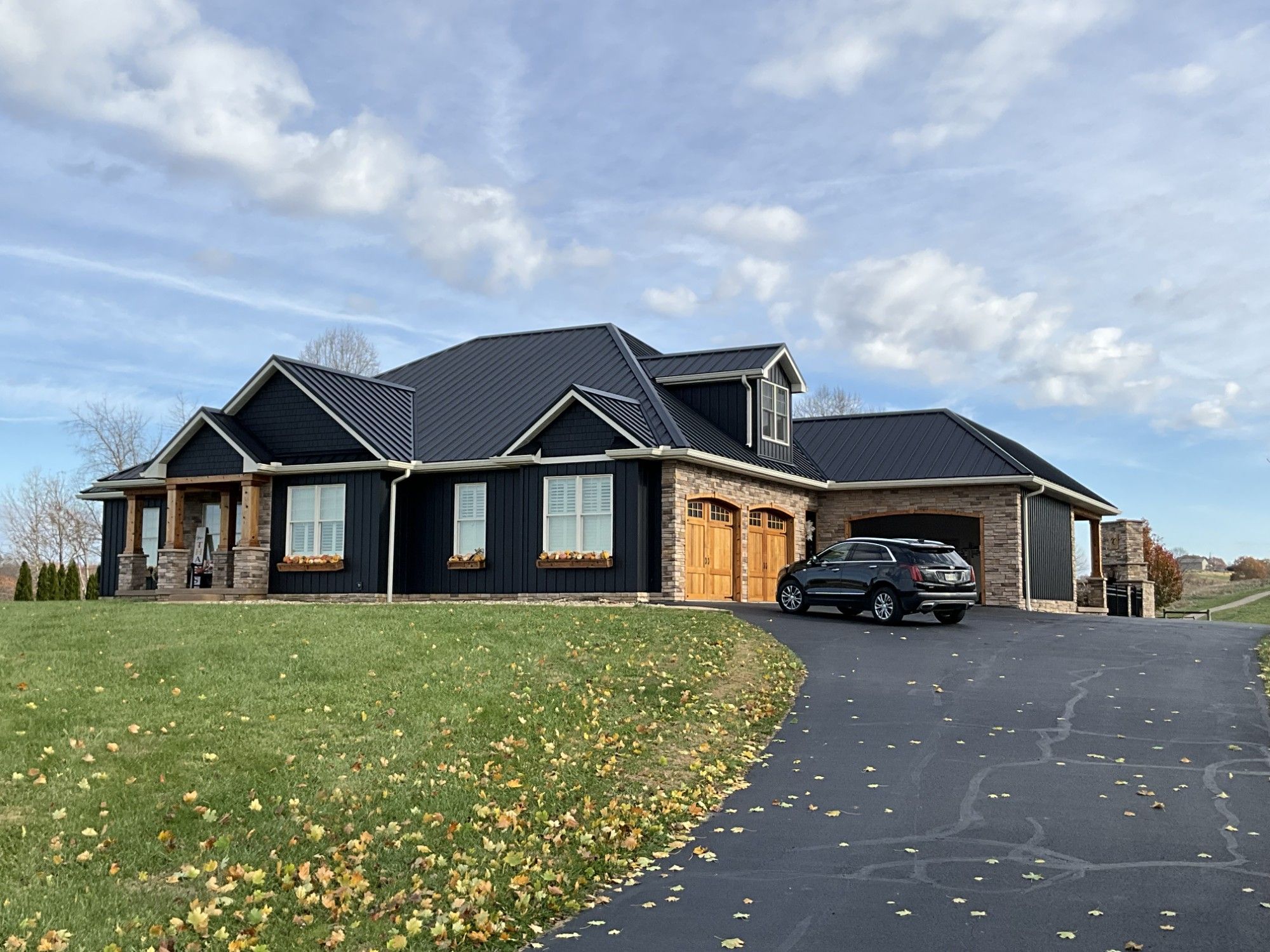 Standing seam metal roof installed by Grand Design Roofing